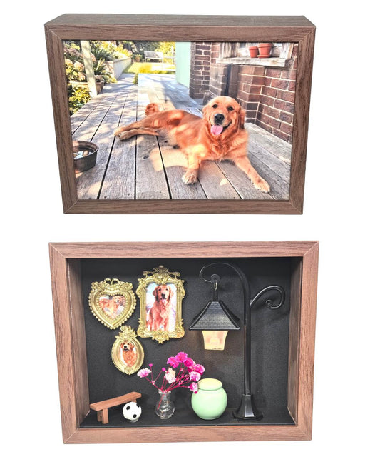 A composite image displaying both sides of a custom wooden pet memorial shadow box. The top view features a full 10x15cm photo of a resting Golden Retriever, while the bottom view reveals the reverse side's 3D diorama, complete with vintage miniature frames, a glowing street lamp, pink flowers, a tiny bench, and a green ceramic keepsake jar.