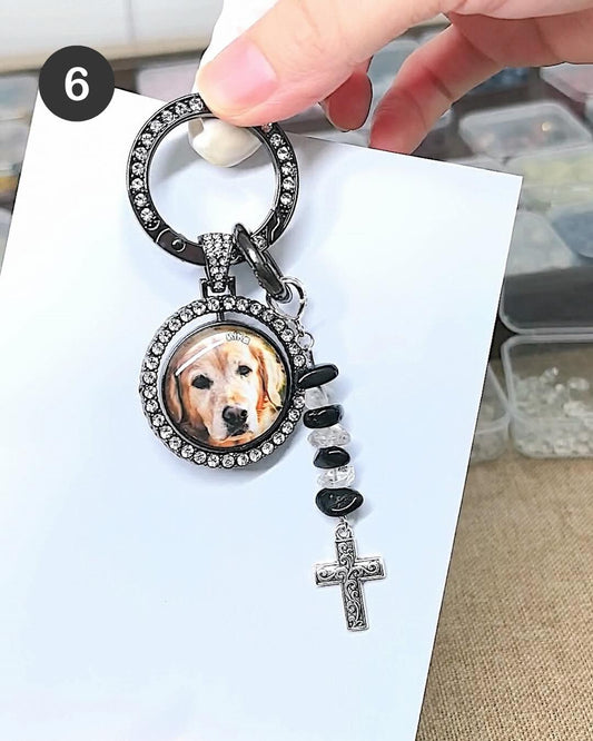 Close-up of a custom dog photo keychain with a personalized pet portrait charm.