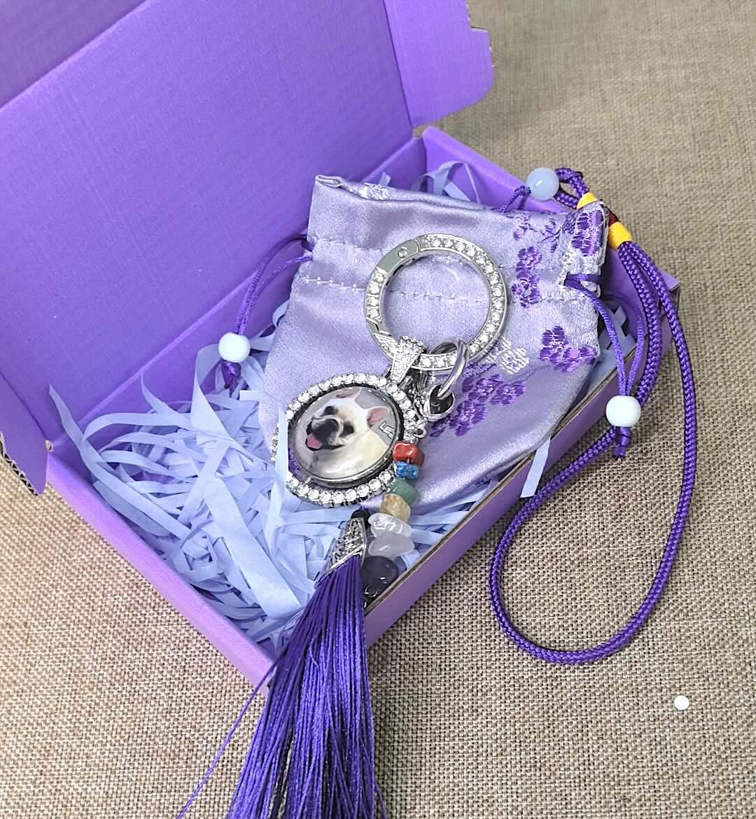 Custom dog photo memorial keychain with crystal charm and purple keepsake gift packaging