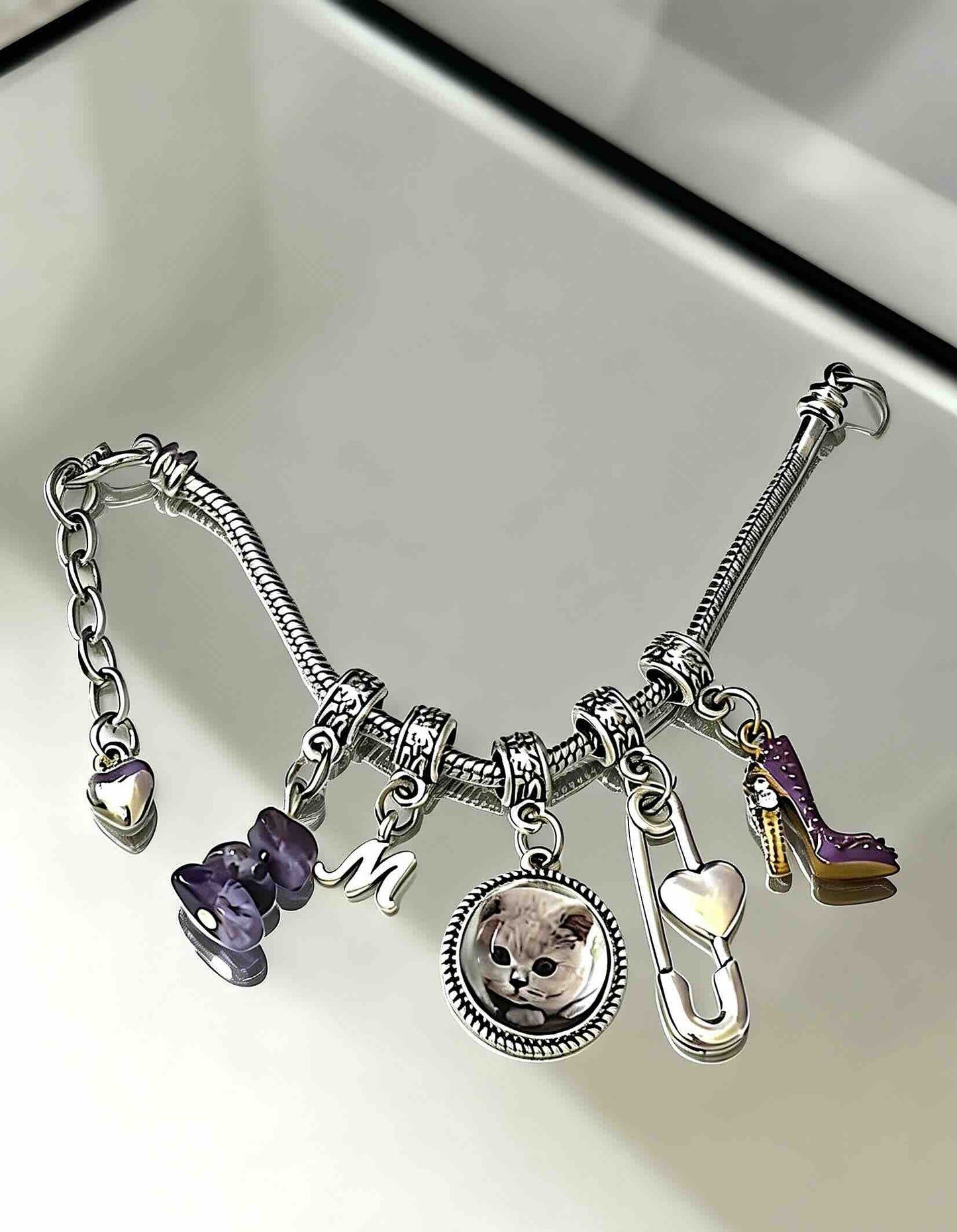 A touching pet loss sympathy gift featuring a custom crystal portrait charm, a meaningful keepsake to keep your rainbow bridge pet close forever.