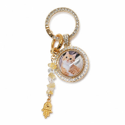 Handmade custom cat photo memorial keychain being assembled with personalized pet picture