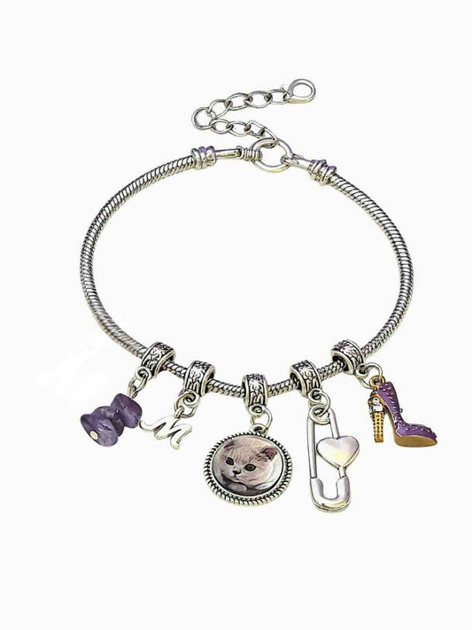 Handcrafted natural Amethyst crystal bag charm for pet memorial, featuring a custom pet portrait and healing purple gemstones to soothe grief.