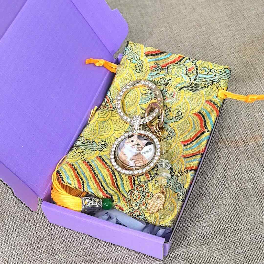 Personalized cat memorial photo keychain presented in a decorative keepsake gift box