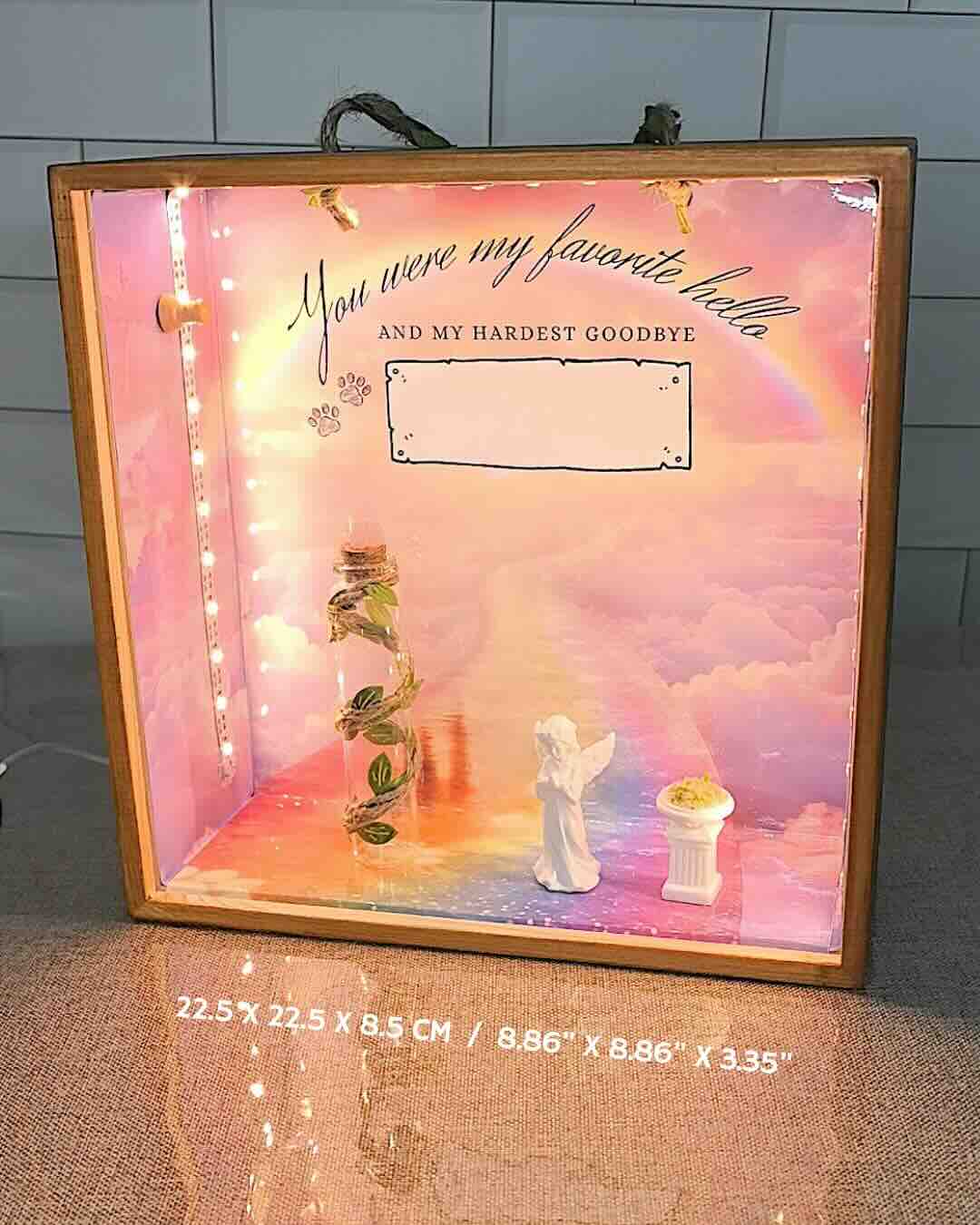 Product dimensions view of the rainbow bridge pet memorial shadow box, 8.86x8.86x3.35 inches, showing the wooden frame and memorial display setup.
